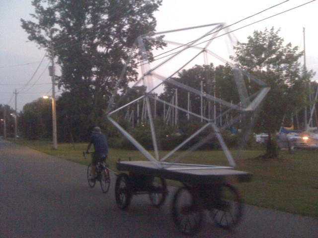 Towing a deathtrap around the island by bicycle and mailcart